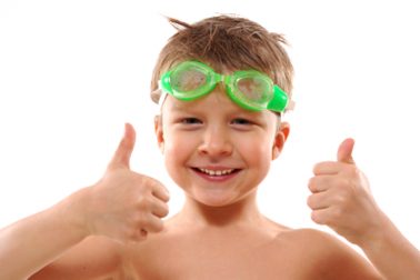 child with goggles and thumbs up