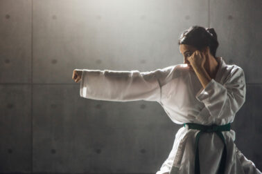 Woman in kimono practicing karate